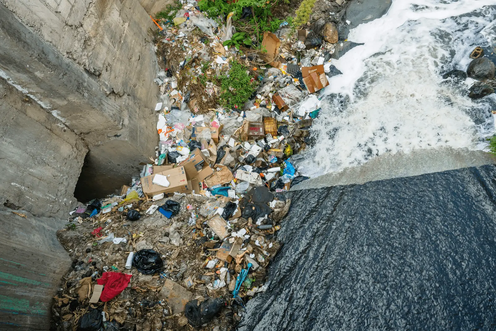 Illegally dumped waste in a coastal gully